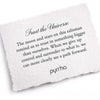 A hand-torn, letterpress printed card describing the meaning for Pyrrha's Trust the Universe Wide Braided Bracelet
