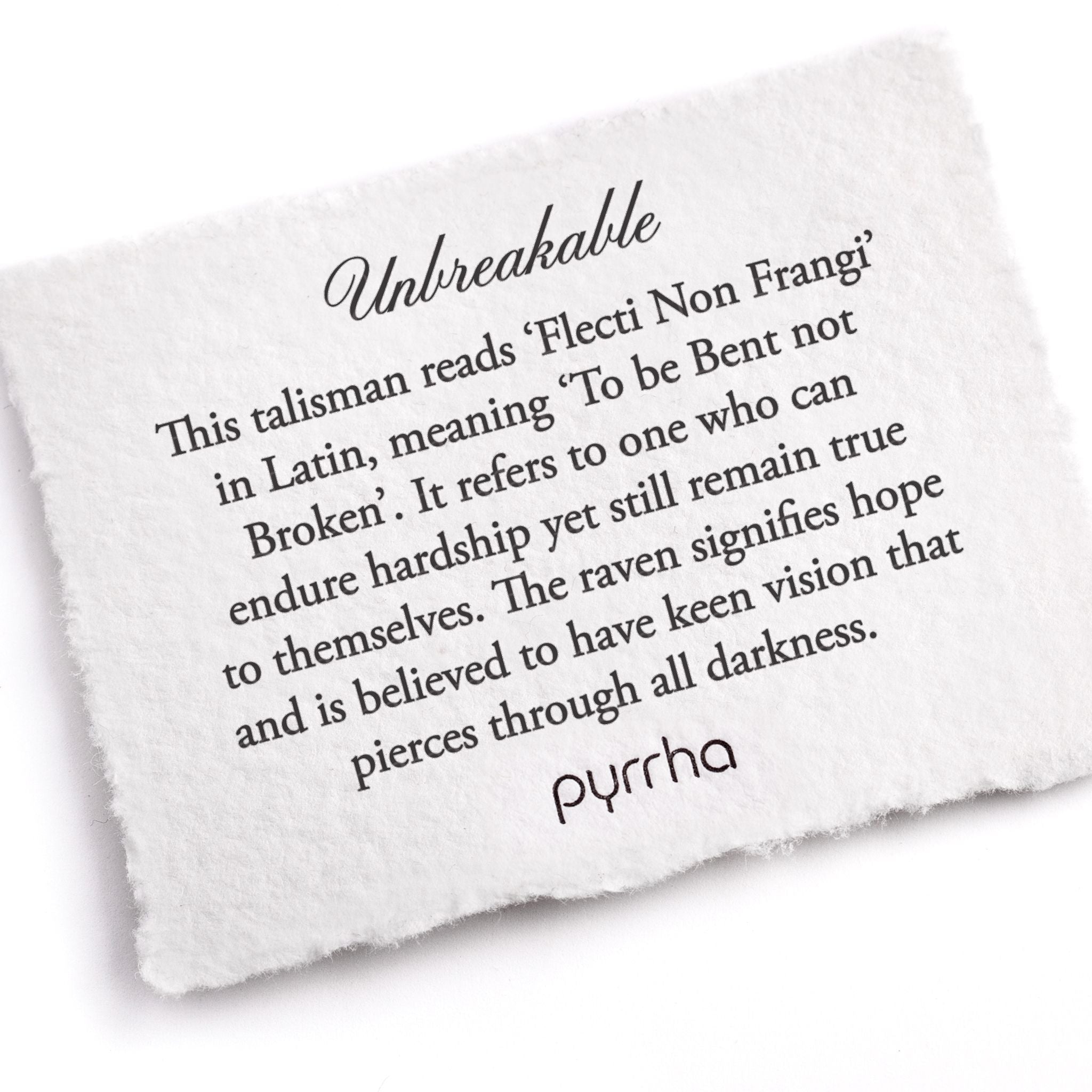 A hand-torn, letterpress printed card describing the meaning for Pyrrha's Unbreakable Talisman Necklace