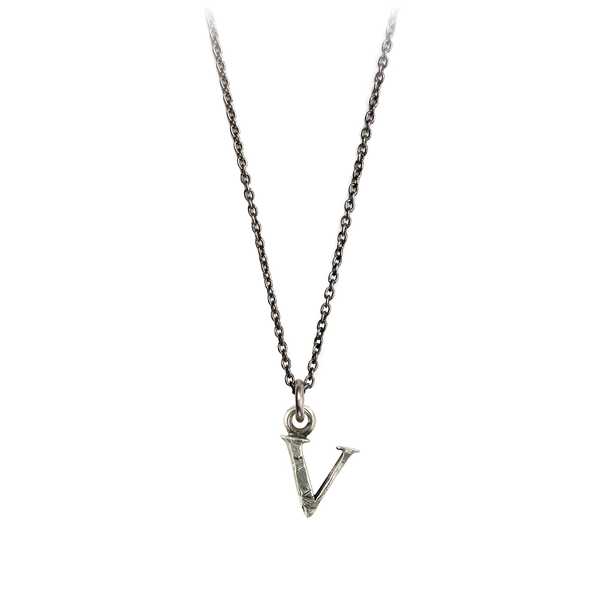 A sterling silver letter "V" charm on a silver chain.