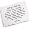 A hand-torn, letterpress printed card describing the meaning for Pyrrha's Walking Meditation Signature Talisman Necklace