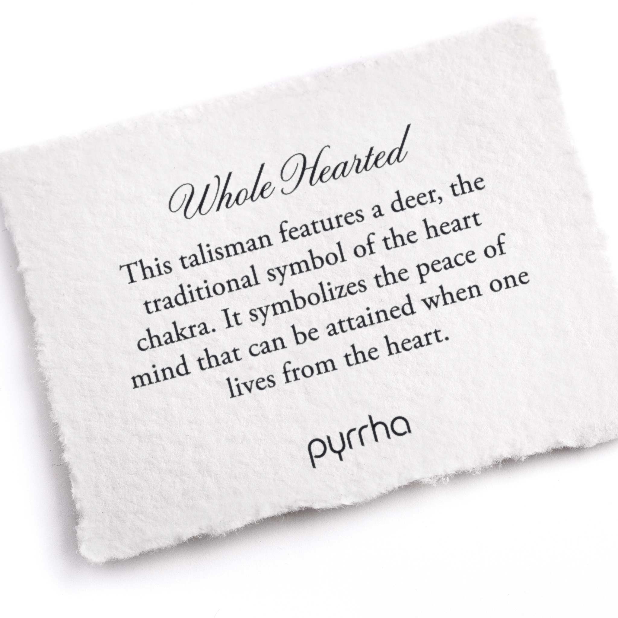 A hand-torn, letterpress printed card describing the meaning for Pyrrha's Whole Hearted Talisman