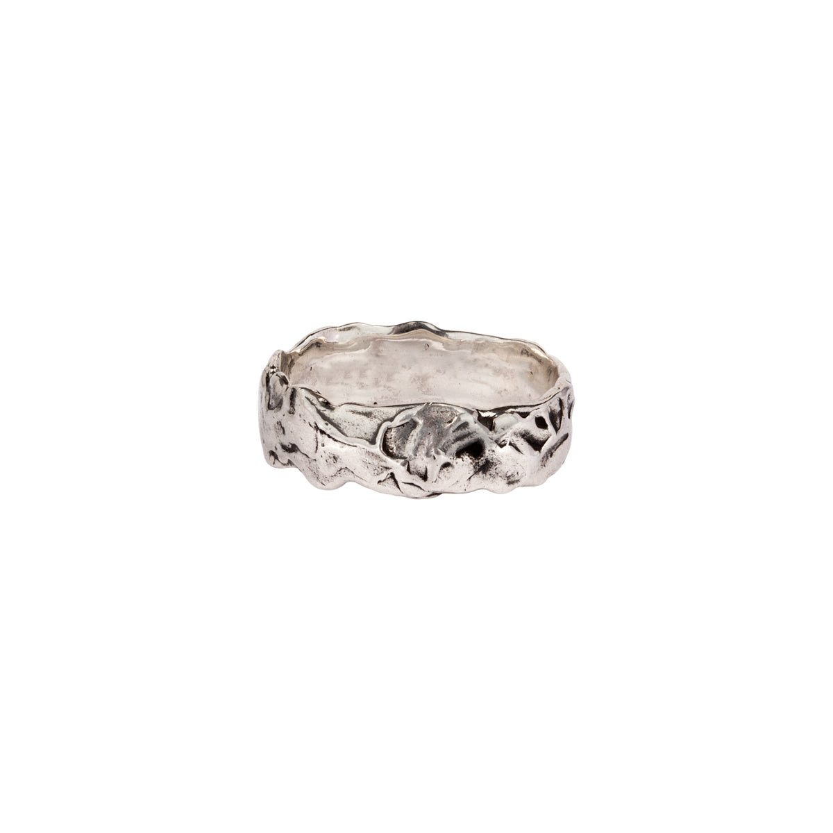 A wide silver band ring uniquely textured by hand