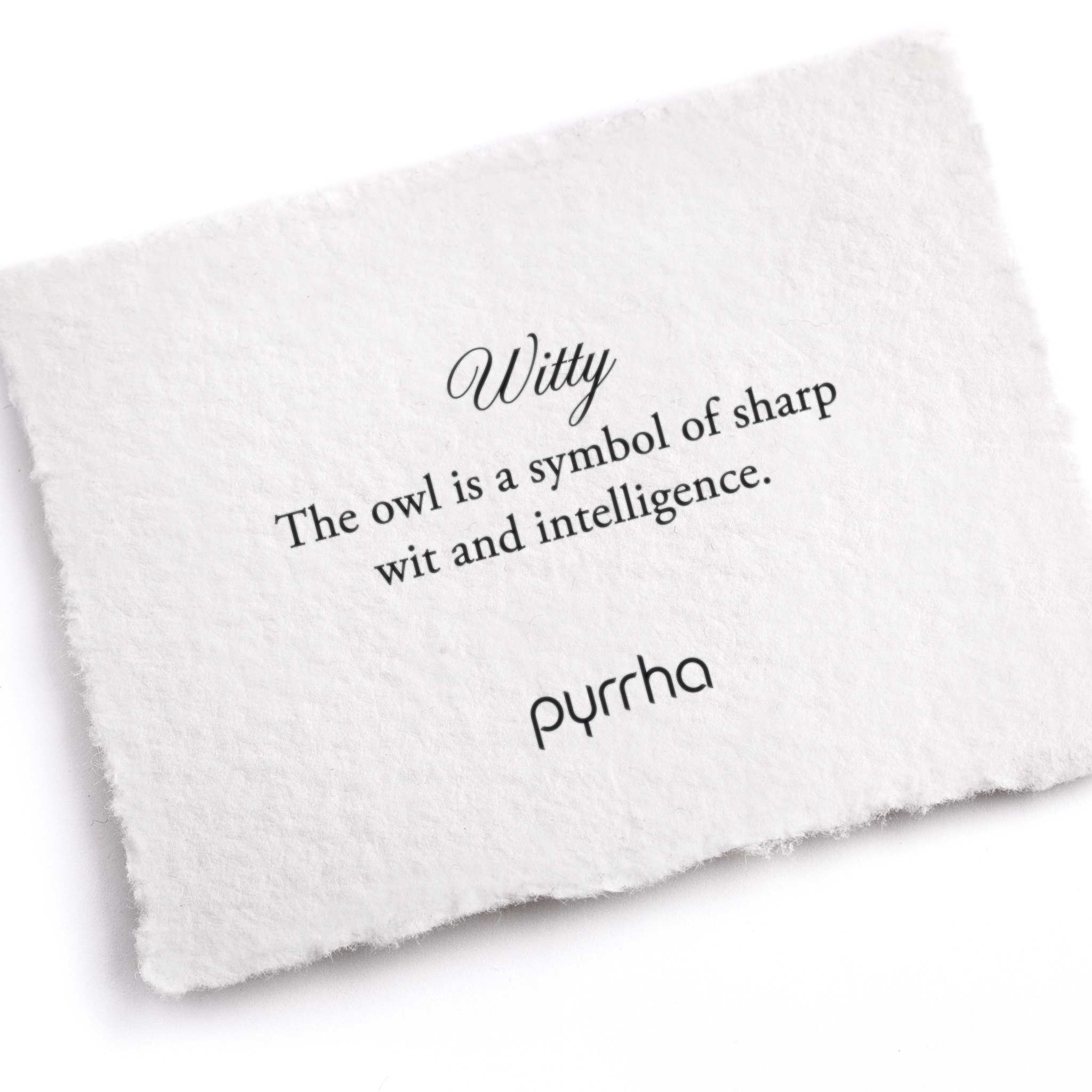 A hand-torn, letterpress printed card describing the meaning for Pyrrha's Witty Appreciation Talisman