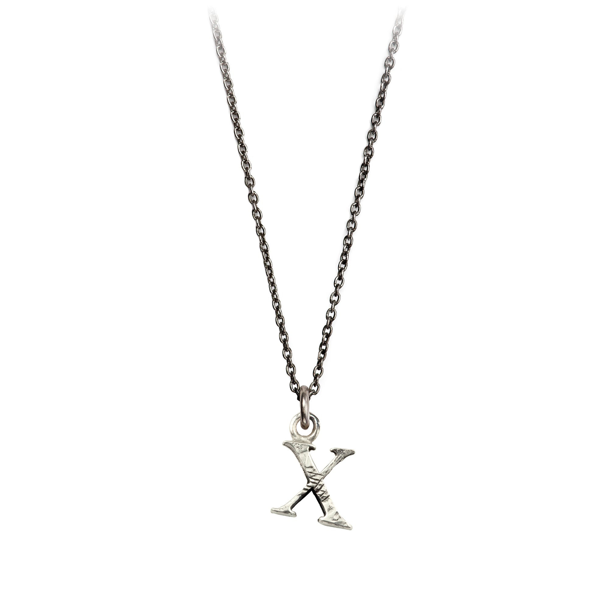 A sterling silver letter "X" charm on a silver chain.
